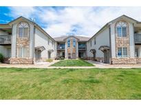 Charming condo building featuring beautiful stone accents and manicured lawn in a desirable community at 3250 E 103Rd Pl # 805, Thornton, CO 80229