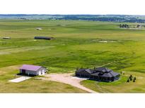 Expansive property with a modern home, large garage, and plentiful land at 26100 County Road 5, Elizabeth, CO 80107