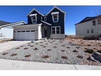 Charming two-story home with a stone facade, a two car garage, and xeriscaped front yard at 4228 Ridgewalk Pt, Castle Rock, CO 80108