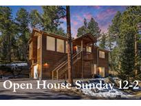 Charming two-story wood home with an open house on Sunday from 12-2 at 6752 S Columbine Rd, Evergreen, CO 80439