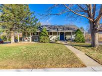 Charming ranch home with a welcoming front porch and yard at 3200 S Grape St, Denver, CO 80222