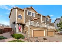 Charming two-story home features a deck, two-car garage, and well-maintained landscaping at 2673 Live Oak Ct, Castle Rock, CO 80104