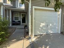 Exterior of home featuring a garage and front entrance at 7883 S Kalispell Cir, Englewood, CO 80112