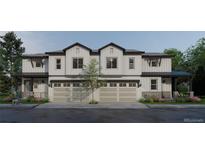 New construction townhome showcasing white siding and black trim with two-car garages at 4024 Upham St, Wheat Ridge, CO 80033