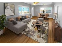 Inviting living room featuring a stylish sectional, wood floors, and ample natural light at 828 Mariposa St, Denver, CO 80204