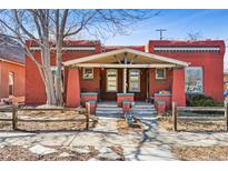 Charming red brick home with inviting front porch and well-maintained landscaping at 279 Delaware St, Denver, CO 80223
