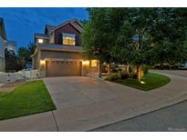 Charming two-story home with a well-manicured lawn, covered porch, and two car garage at 3540 Brushwood Dr, Castle Rock, CO 80109