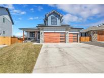 Beautiful two-story home with a three car garage and a well-maintained lawn at 804 Spyglass Cir, Louisville, CO 80027