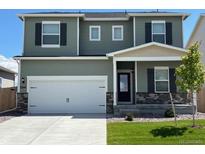 Charming two-story home with a two-car garage and well-maintained lawn at 2244 Alyssa St, Fort Lupton, CO 80621