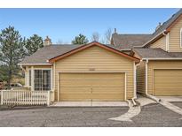 Attached one car garage for convenient parking and storage in this well maintained townhouse at 10507 W Maplewood Dr # E, Littleton, CO 80127