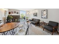 Inviting living room with fireplace and access to private balcony at 805 29Th St # 308, Boulder, CO 80303