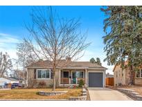 Charming ranch home with landscaped yard and attached garage at 2602 S Lafayette St, Denver, CO 80210