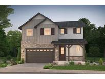 Charming two-story home featuring stone accents, a covered porch, and a well-maintained front yard at 2142 S Irvington St, Aurora, CO 80018