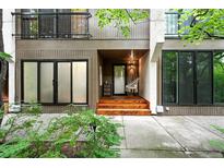 Inviting front entrance featuring a hanging swing chair and warm wood steps at 960 N Pennsylvania St # 6, Denver, CO 80203
