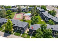 An aerial view of the apartment complex with amenities, including a pool and tennis court at 6856 S Broadway, Centennial, CO 80122