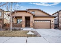 Attractive ranch-style home with stone accents and a two-car garage at 25064 E Byers Dr, Aurora, CO 80018