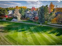 Luxury home on golf course with mature trees in fall colors at 98 Glenmoor Ln, Cherry Hills Village, CO 80113