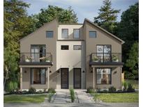 Modern townhouse with dual balconies and a neutral color palette complemented by lush landscaping at 2281 S Sherman St, Denver, CO 80210