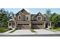 Charming two-story home with a two car garage and a well-manicured lawn at 6751 Arbor E Blvd, Thornton, CO 80602