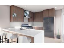 Modern kitchen with stainless steel appliances, a breakfast bar, and stylish pendant lighting at 3728 W 1St Ave, Denver, CO 80219