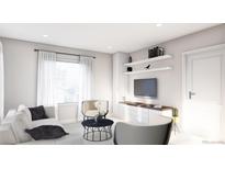 Bright living room with large window, floating shelves, stylish furniture, and modern decor at 3728 W 1St Ave, Denver, CO 80219