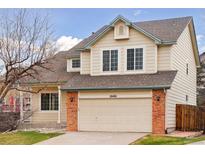 Charming two-story home with attached two car garage and brick accents at 20481 E Mansfield Pl, Aurora, CO 80013