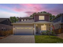 Charming home featuring a well-manicured lawn and a spacious two-car garage, perfect for suburban living at 7933 Florado St, Denver, CO 80221