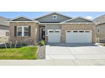 Charming single-story home with a well-manicured lawn and a convenient three-car garage, located in a desirable neighborhood at 6980 S Yantley Ct, Aurora, CO 80016