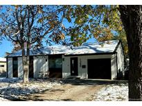 Charming single-Gathering home featuring a modern exterior with a well-manicured lawn and an attached garage at 1360 S Forest Way, Denver, CO 80222