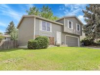 Charming two-story home featuring a well-manicured front lawn and attached two-car garage at 4580 W 109Th Ave, Westminster, CO 80031