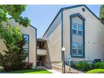 Inviting exterior of a multi-story condo complex showcasing reserved parking and lush landscaping at 447 S Memphis Way # 7, Aurora, CO 80017