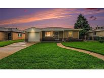 Charming single-story home with a well-manicured lawn and inviting curb appeal, perfect for a cozy lifestyle at 2321 Lima St, Aurora, CO 80010