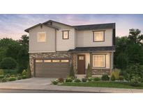 Beautiful two-story home with stone accents, a covered front porch, and a two-car garage at 2187 S Jackson Gap St, Aurora, CO 80018