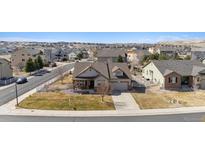 Charming single-Gathering home featuring a well-maintained lawn and a cozy front porch in a desirable neighborhood at 4143 Eagle Ridge Way, Castle Rock, CO 80104