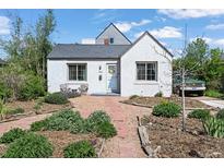 Charming single story home with a landscaped front yard and stone walkway at 1354 Tamarac St, Denver, CO 80220