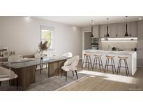 Bright dining space features a table with seating for six, modern light fixtures, and a hardwood floor at 314 Galapago St, Denver, CO 80223