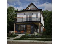 Modern two-story home with eye-catching balconies, wood accents, manicured landscaping, and vibrant seating area at 314 Galapago St, Denver, CO 80223