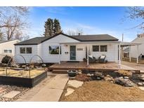 Charming home featuring a front porch with seating and well-maintained landscaping at 3256 S Glencoe St, Denver, CO 80222