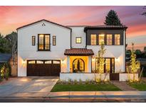 Stunning two-story home showcasing a blend of modern design and classic charm with professional landscaping at 200 Magnolia St, Denver, CO 80220