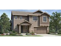 Charming two-story home with a two-car garage and nicely landscaped front yard at 6341 Las Palmas Pt, Parker, CO 80134