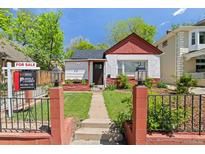 Charming home featuring a well-maintained front yard with a walkway leading to the front door and a 'For Sale' sign at 3024 S Sherman St, Englewood, CO 80113