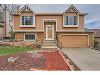 Charming two-story home featuring a well-maintained front yard and inviting entryway at 18981 E Mercer Dr, Aurora, CO 80013