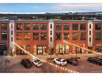 Charming brick building exterior with decorative lighting and street view at 7110 W Alaska Dr # A, Lakewood, CO 80226