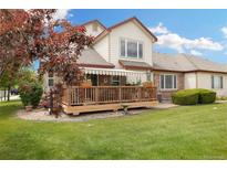 Expansive backyard featuring a spacious wooden deck perfect for entertaining and outdoor living at 16753 W 61St Ln, Golden, CO 80403