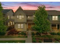 Charming two-story home featuring a covered porch, lush landscaping, and a welcoming facade at 540 E Fremont Pl, Centennial, CO 80122