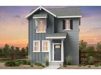 Charming two-story home features vertical siding, white trim, and a welcoming front entrance at 6601 E 148Th Dr, Thornton, CO 80602