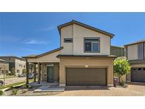 Two-story home featuring a two-car garage and a covered front porch under a clear blue sky at 19118 E 54Th Pl, Denver, CO 80249