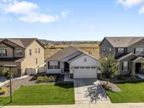 Charming single-Gathering home with a well-manicured lawn, attached garage, and mountain views in a Gathering-friendly neighborhood at 6294 Long Branch Dr, Parker, CO 80134