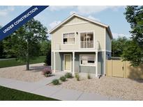 Charming two-story home with a balcony and neutral siding offers modern living with a welcoming facade at 46505 Avery Ln, Bennett, CO 80022