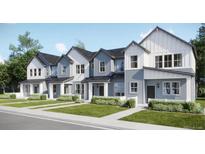 New townhome development showcasing modern farmhouse exteriors and landscaping at 6562 Arbor Blvd # 1, Thornton, CO 80602